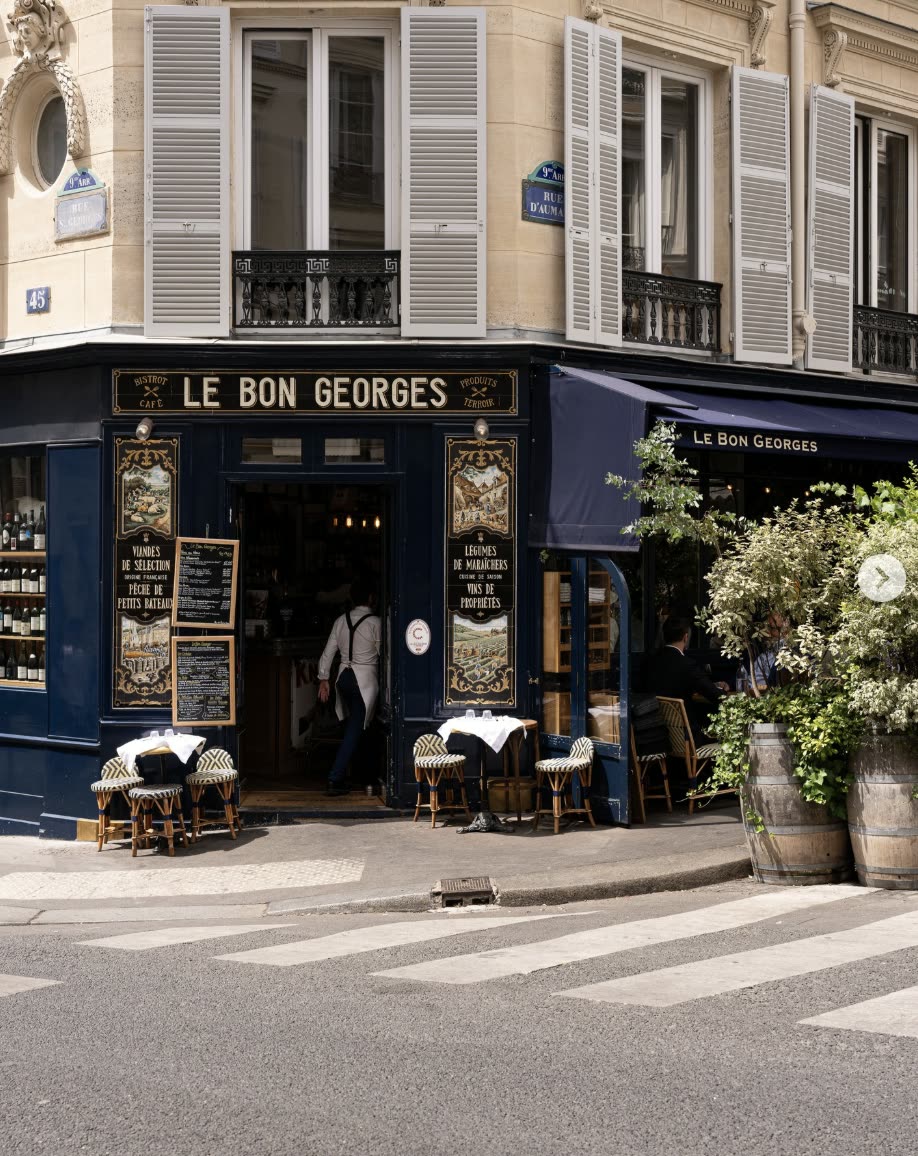 The navy and gold corner frontage of Le Bon Georges on rue Saint-Georges